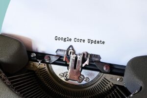 Close-up of a typewriter typing 'Google Core Update' on paper, symbolizing digital advancement.